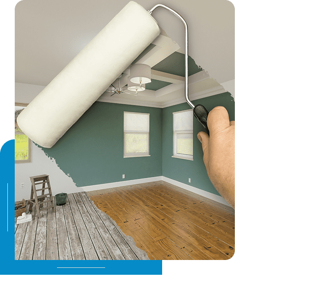Painting a room with a roller brush.